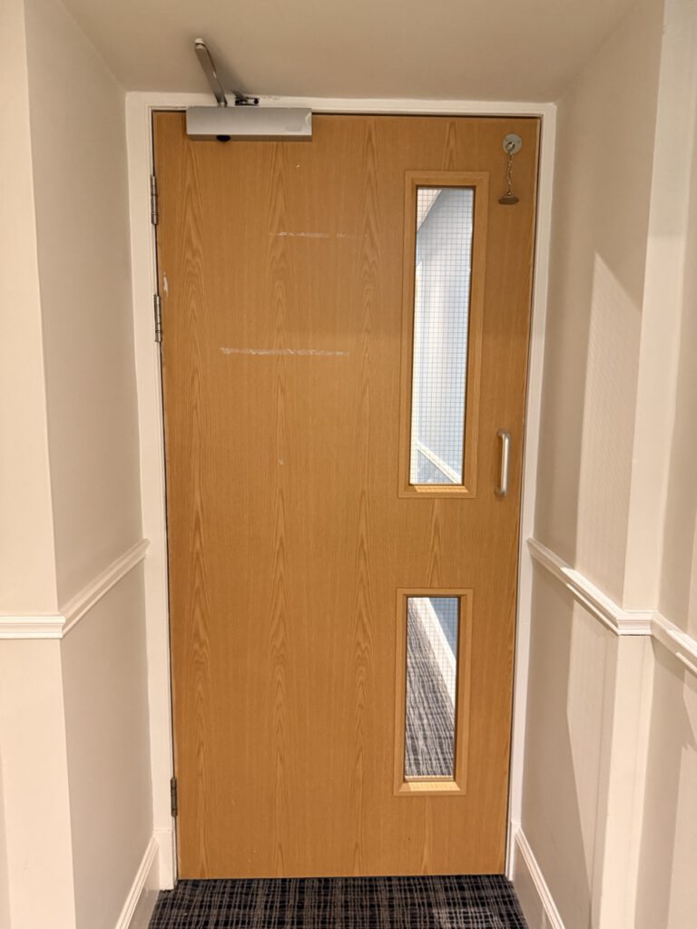 hotel fire door before works